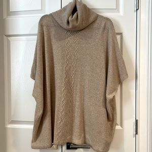 Beautiful wool sweater with wing sleeves.